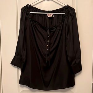 Juicy Couture silk black top with gold apple-button details.